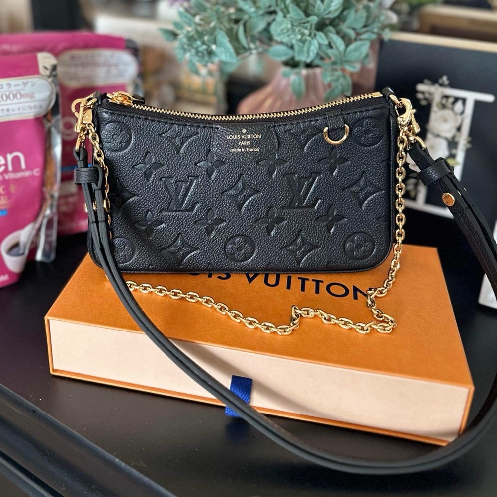 Authentic LV easy pouch on strap monogram Empreinte leather.